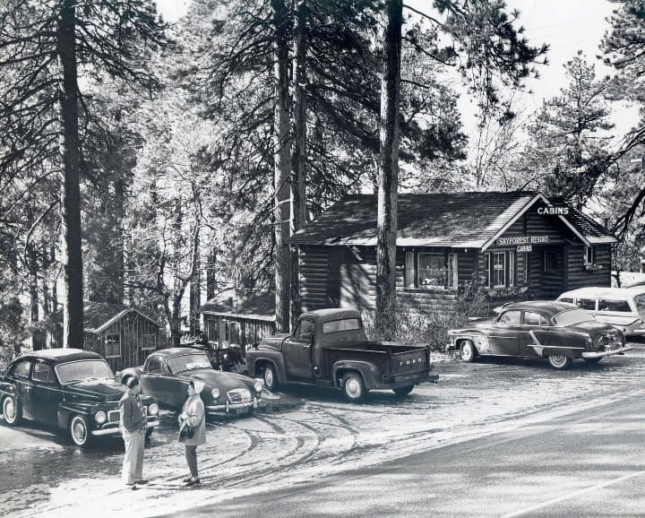 Cars from the 1950s parked outside the cabins at Skyforest